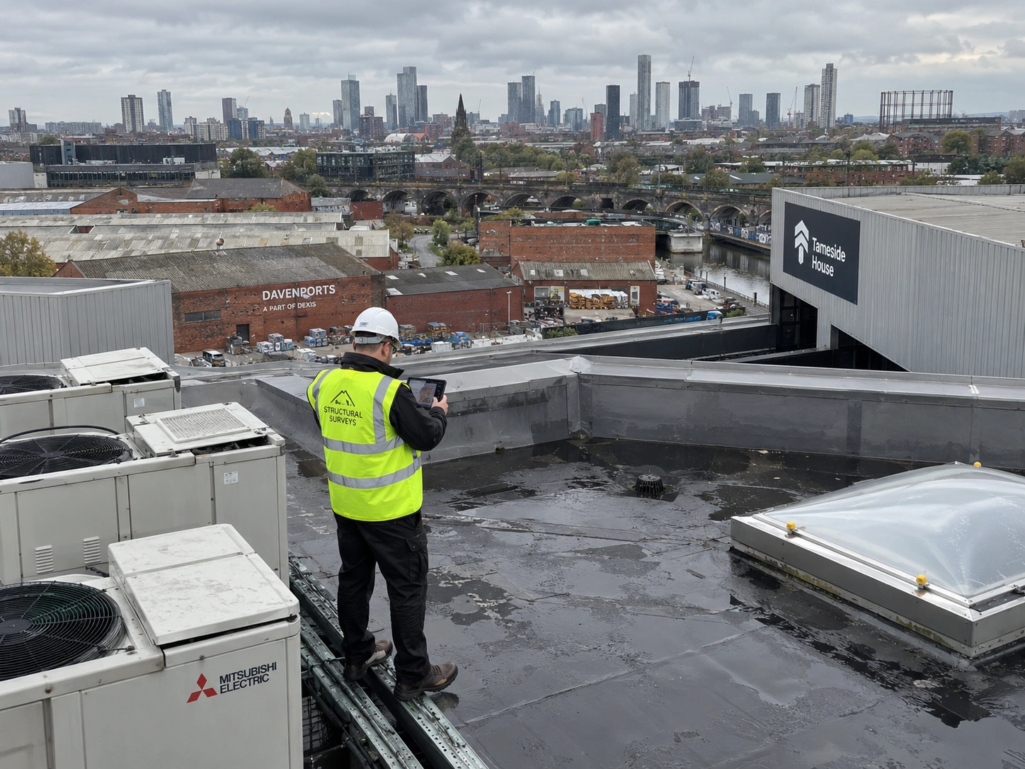 a technician conducting a rooftop structural survey on a commercial/industrial building, using a tablet or camera to document findings, shot from an elevated angle