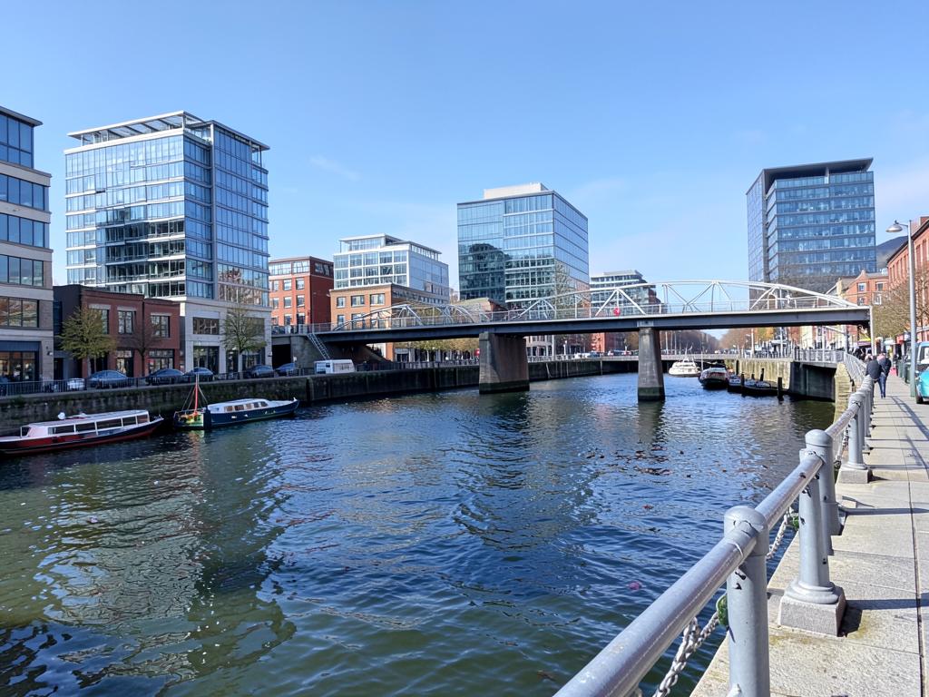 Salford waterfront with modern buildings and a footbridge
