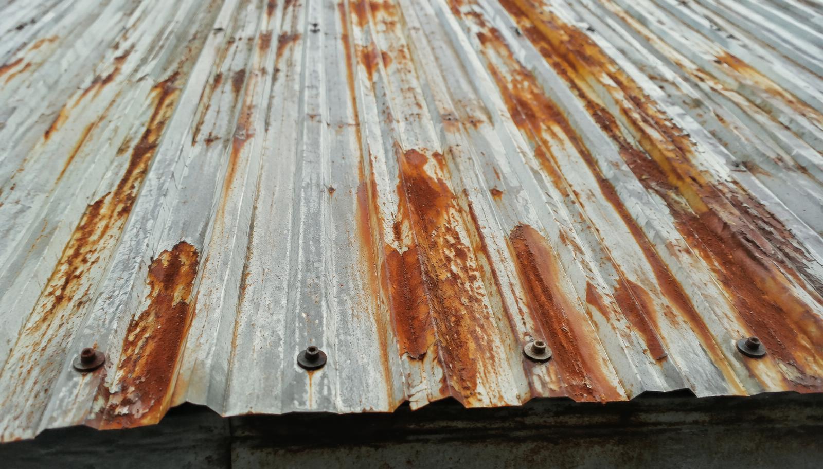 Corroded industrial roof sheeting in need of repair