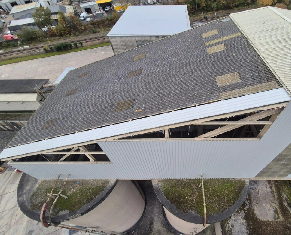 Aerial view of the silo head house roof in West Yorkshire before works began, showing ageing sheeting