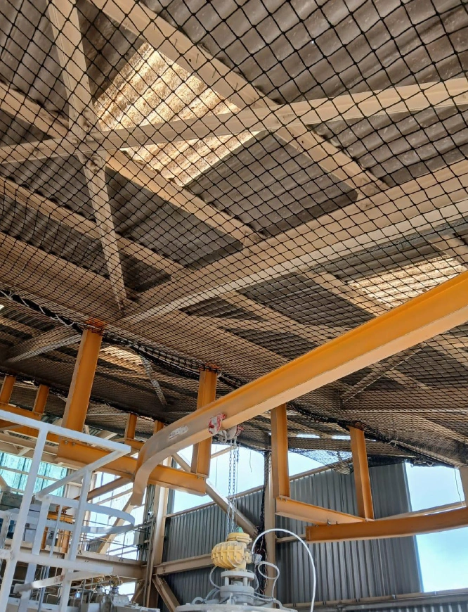 Interior view showing safety netting installed beneath the roof structure